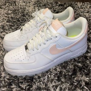 White Air Force 1’s with light pink Nike sign